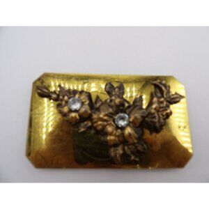 Belt Buckle Brass tone with Sculpted flowers and 2 glass stones.